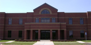 Photo of the brown brick front of the Shared Services Center building located in Sandersville, Georgia.
